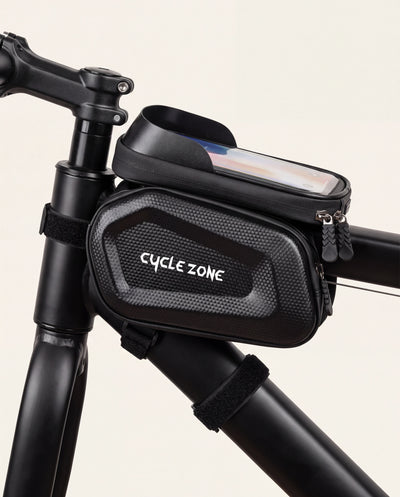 Fixation par sangles auto-agrippantes de la sacoche porte-téléphone sur le tube supérieur du vélo